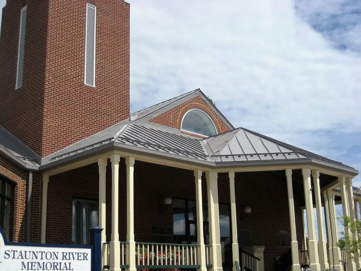 Skilled roofing craftsmen working on a residential roof in Six Forks